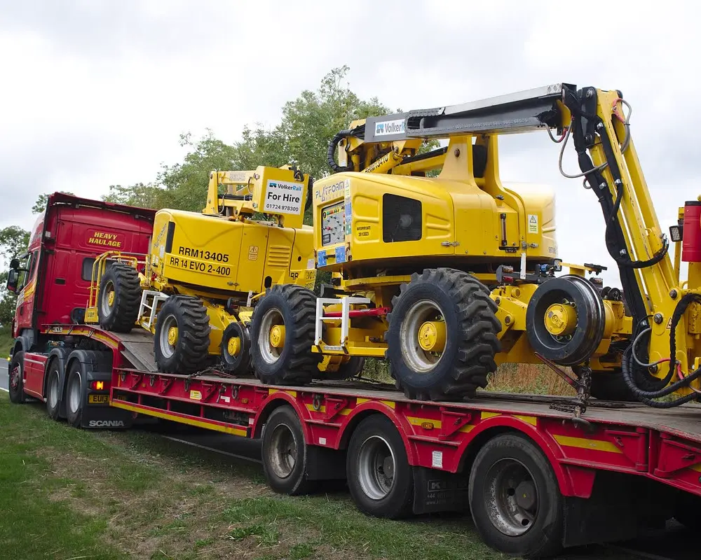 Industrial machinery secured on a lowboy trailer